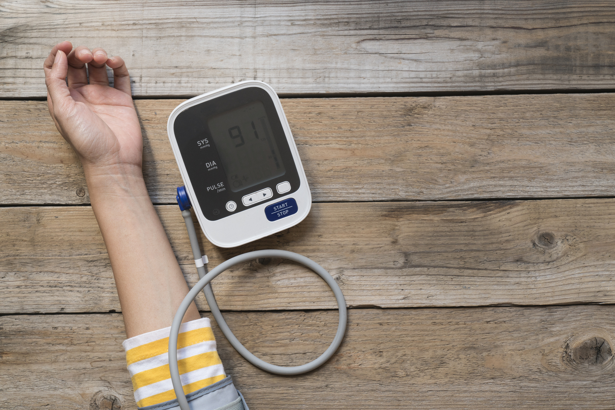 Woman's arm while measuring her blood pressure